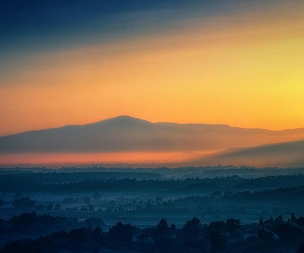 Beautiful sunrise light through a hazy violet atmosphere